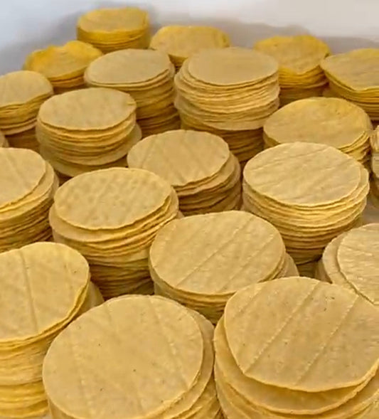 Piles of freshly made Yellow Corn Organic Tortillas
